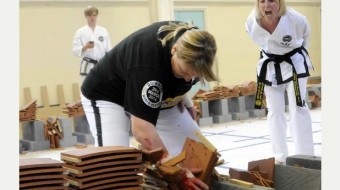 UK female Taekwon-Do champ smashes 1000 Roof Tiles real fast